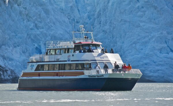 Glacier Quest catamaran cruising along the coastline